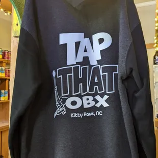 a black hoodie with the words tap that obx on it