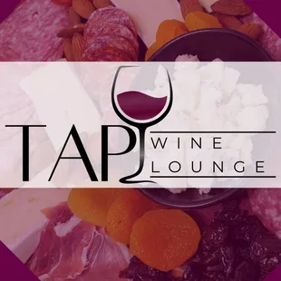 a plate of food with a glass of wine