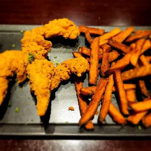 Chicken fingers witha double side of sweet potato fries