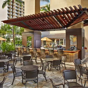outdoor seating area with tables and umbrellas