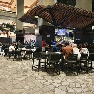 View of the bar (to the right) and seating area.