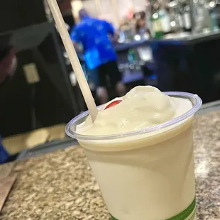 Piña Colada. It's a slushy cocktail for a sloshy girl. Not very strong and just a little watery.