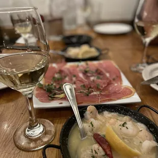 a bowl of soup and a glass of wine
