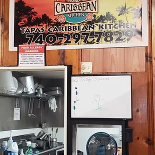 a sign for tapas caribbean kitchen