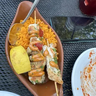 Chicken skewers and Spanish rice