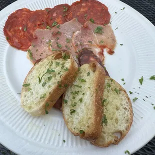 Meatballs in marinara, garlic toast with cured meats