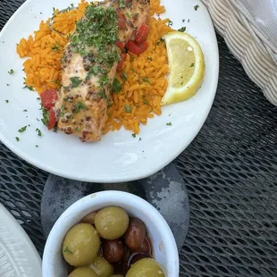 Salmon with lemon butter sauce and Spanish rice. BEST OLIVES EVER.... Duh