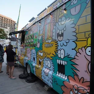 a food truck decorated with cartoon characters