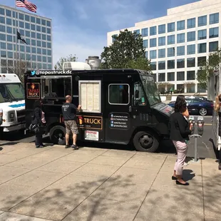 people getting food from the truck