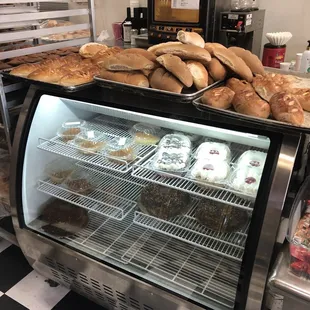 a display case filled with baked goods