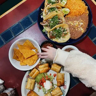 a person grabbing a plate of food