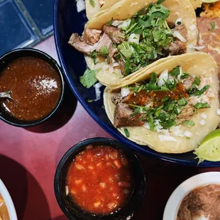 a plate of tacos and chips