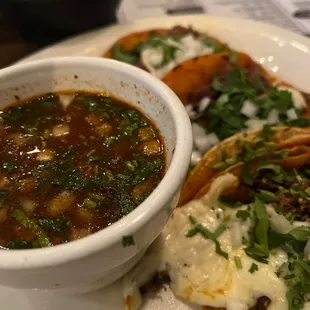 a bowl of soup and a plate of food