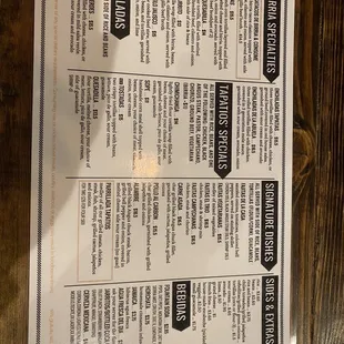 a menu on a wooden table