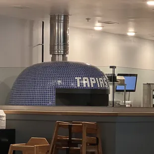a pizza oven in the background