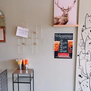 a coffee shop with various items on the wall