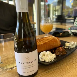 Walk with pups to a neighborhood best for some hazy IPA and Sauv Blanc...with cheese :)