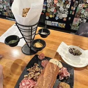 Charcuterie, pita points and olives