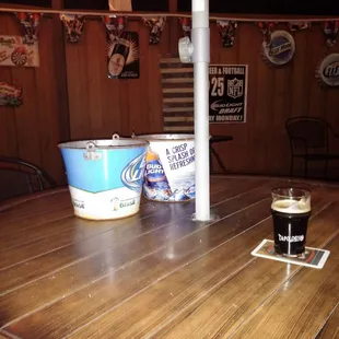 Imperial stout on wood patio table.