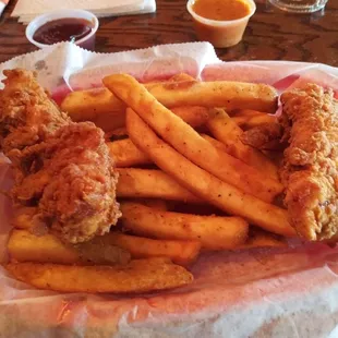 Chicken tenders with French fries.