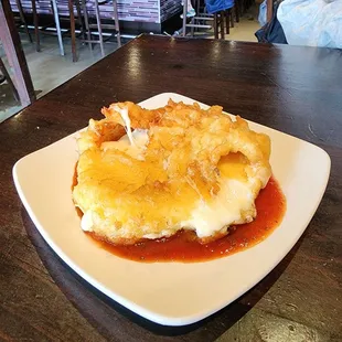 The Cheese Wheel. Very tasty wheel of mild nutty provolone that is batter dipped and fried.