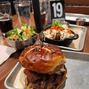 Pretzel burger, side salad, loaded tots