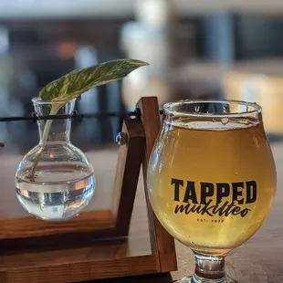 a glass of beer on a table