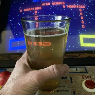 Mad Bark cinnamon hard cider, and Wizard of Wor in the background