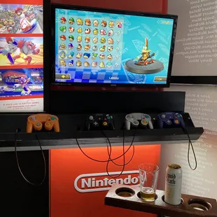 Nintendo Switch display, Octorock cider beer, and Liquid Death water