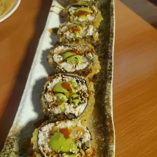 a row of sushi rolls