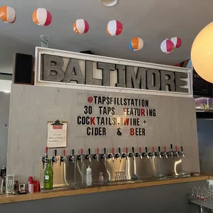 a bar with a sign above it