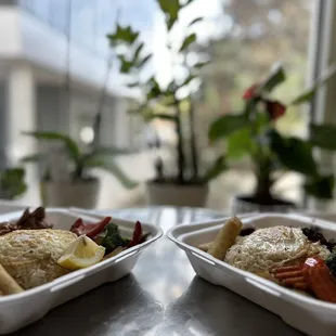 two containers of food on a table