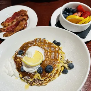 Bacon, lemon-ricotta pancakes, and fruit