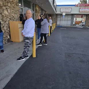 People waiting outside to be allowed in