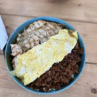 Chilaquiles Rojos spicy with chicken and chorizo