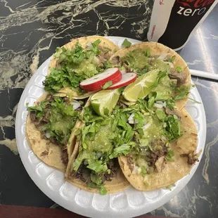 5 tacos 2 beef head tacos, and 3 tounge. Along with a melon water