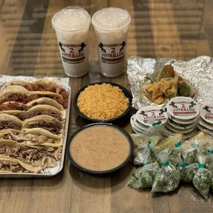 Family Taco Platter (15 tacos, rice, beans, tomatillo, guacatillo): Buche, Lengua (fave), Al pastor. Horchatas are a must!