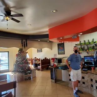 a man standing in a restaurant