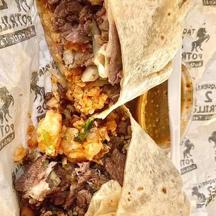 &quot;Surf-n-turf&quot; style burrito, carne Asada w/ shrimp added. Has beans, rice, cilantro &amp; onion. 1 of my all-time faves, so good.
