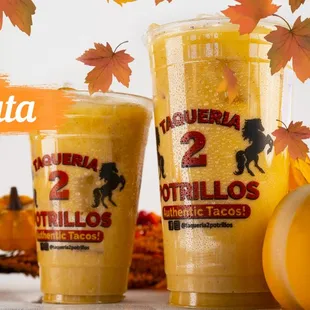 two cups of pumpkin flavored drink