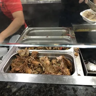 View of food serving line - meats.