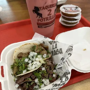 Asada and tripa tacos. Strawberry and banana water