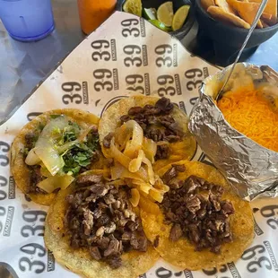a plate of tacos and chips