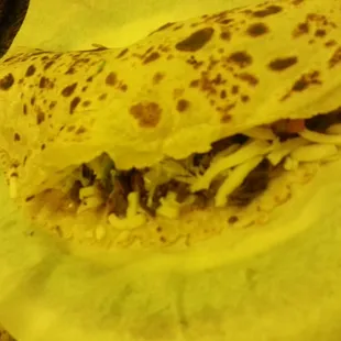 a taqueria sandwich on wax paper