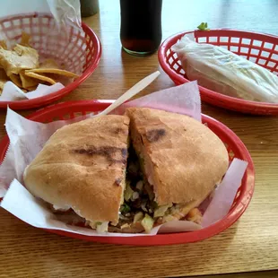 Steak torta, chicken taco and chips