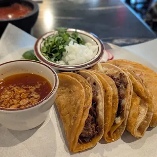 Quesa Birria (beef) - four corn tortillas filled with Oaxaca cheese, barbacoa meat with consome
