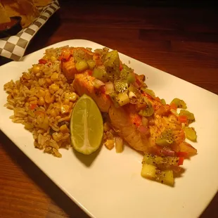 Seared Salmon, kiwi salsa served with New Mexican dirty rice.