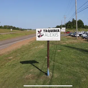 a sign on the side of the road