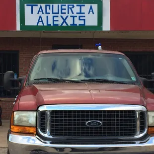 a truck parked in front of a building