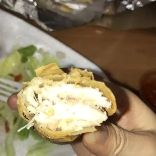 a person holding a piece of food